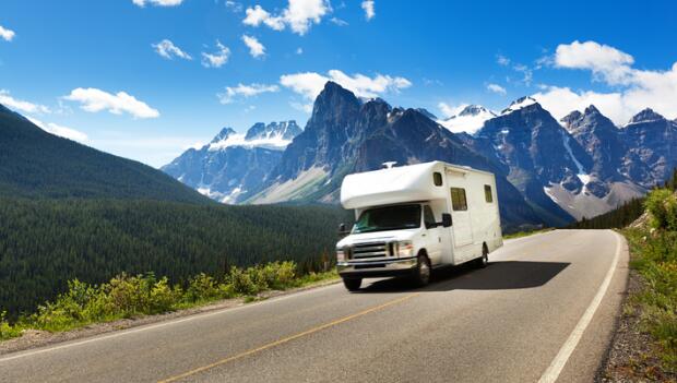 RV driving through scenic mountains, representing reliable RV Insurance in Ankeny, IA by Adamson Insurance & Associates RV driving through scenic mountains, representing reliable RV Insurance in Ankeny, IA by Adamson Insurance & Associates
